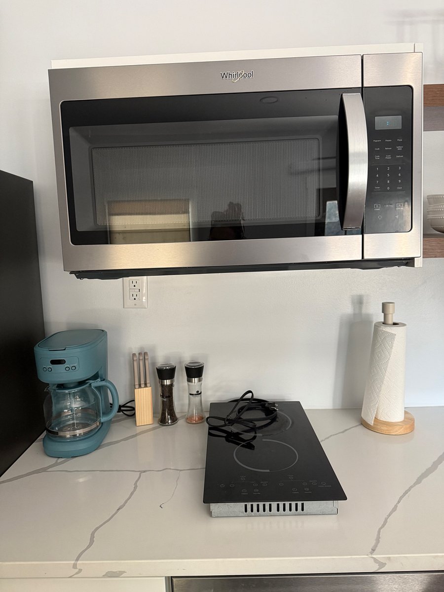 Stocked with coffee maker, bread slice toaster in addition to the countertop oven, pot, pans, strainer, cooking utensils, etc
