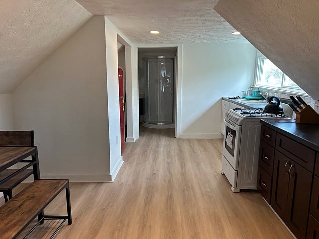 View of full kitchen...Gas stove, and TONS of cabinet space!