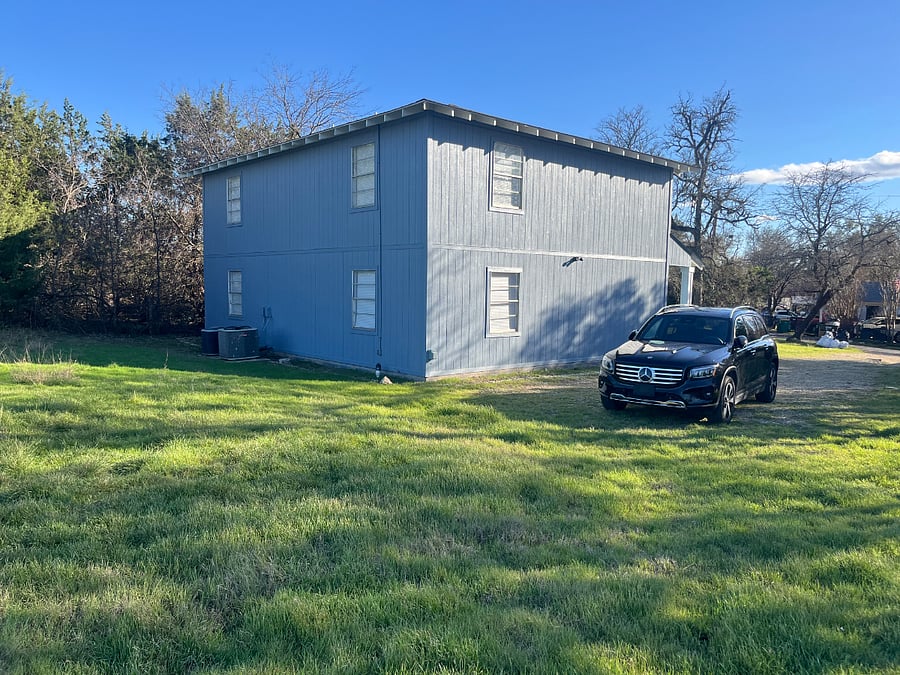 Rear side yard and parking space