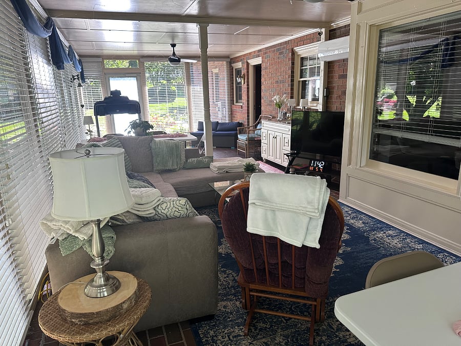 Sunroom with treadmill and a few weights