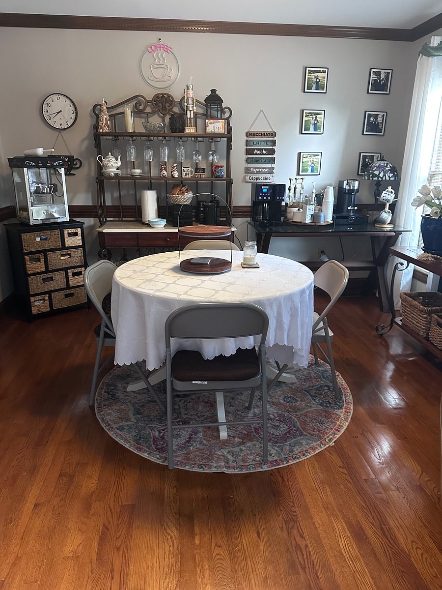 Coffee room with table and a fun popcorn machine!