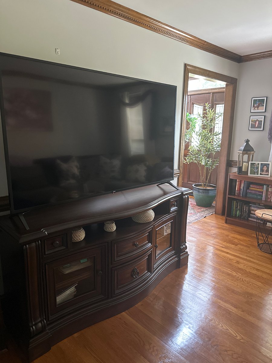 Living room TV with seating to enjoy a football game, basketball, soccer or a great movie.