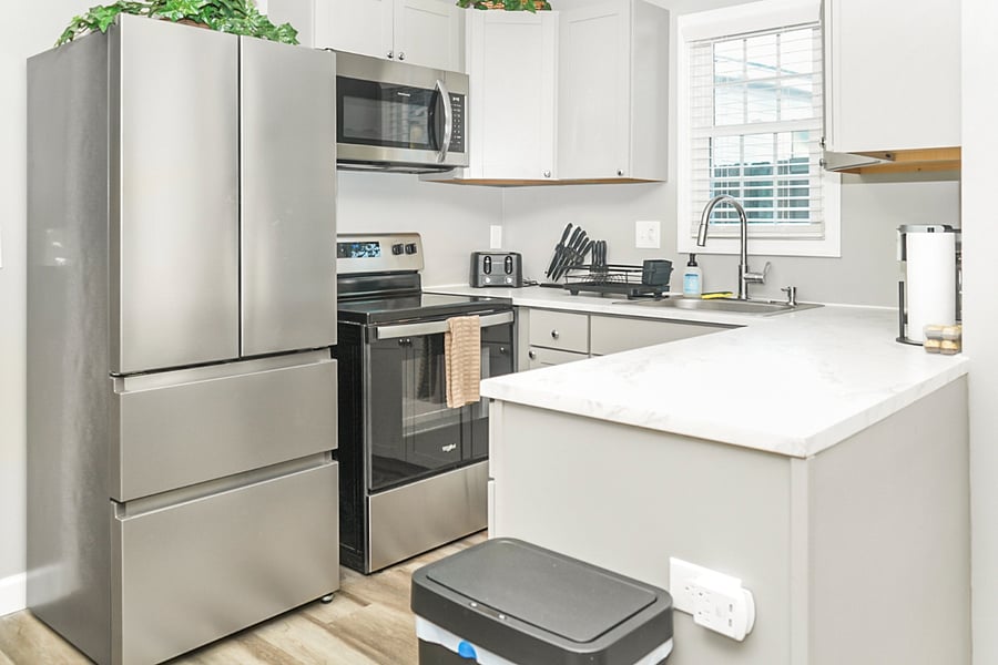 Cook like you're at home in this sleek, fully equipped kitchen with stainless steel appliances, modern finishes, and all the essentials.