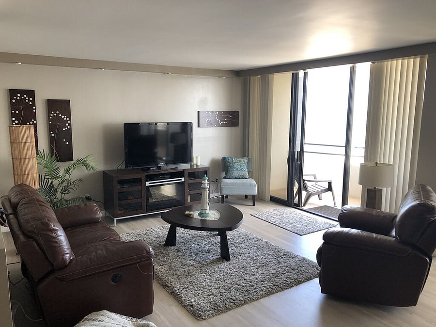 Living room featuring an electric fireplace