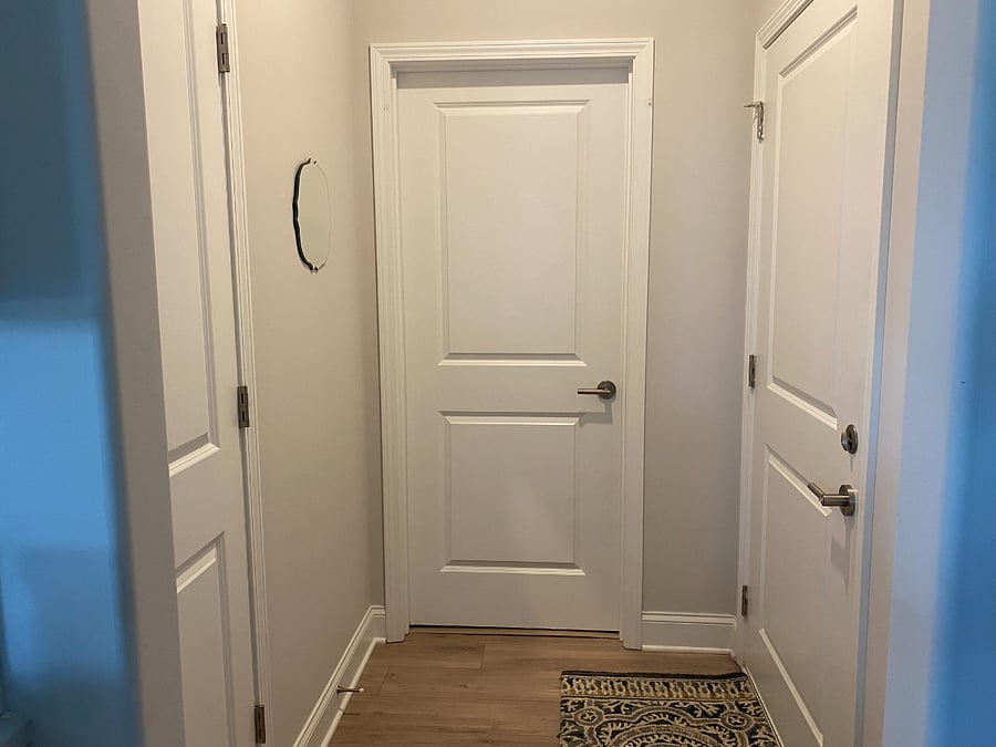 Garage entrance. Door to laundry room and kitchen pantry.