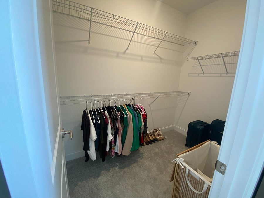 Primary bedroom walk-in closet