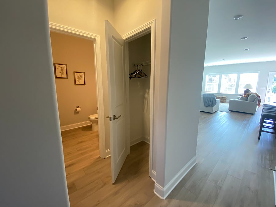 Guest closet on main floor with 1/2 bathroom