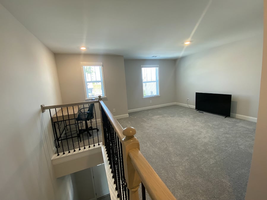 Open loft upstairs with desk nook. Great for office, fitness, movie room, blow-up mattress for visiting guests etc.