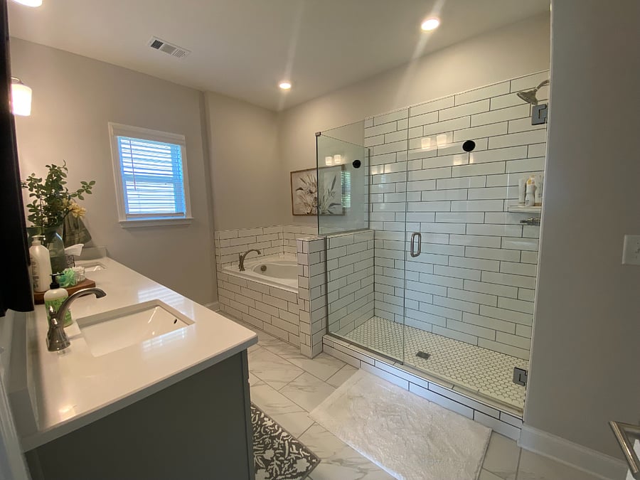 Primary bathroom with soaking tub and walk-in shower. Toilet in private closet.