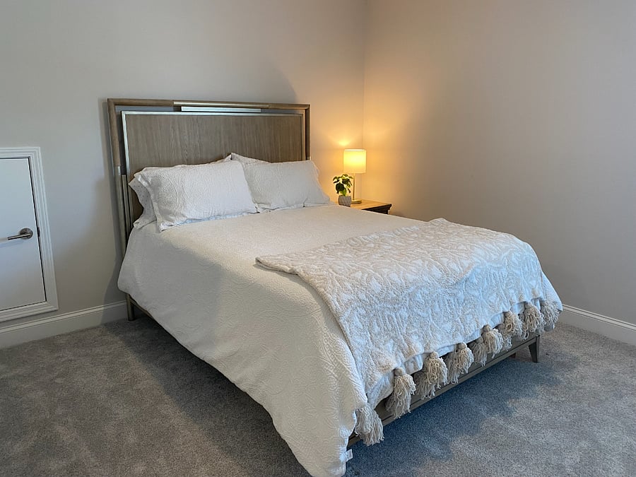 Bedroom 2 on second floor. Little door goes into LARGE attic space for storage (not temp controlled)