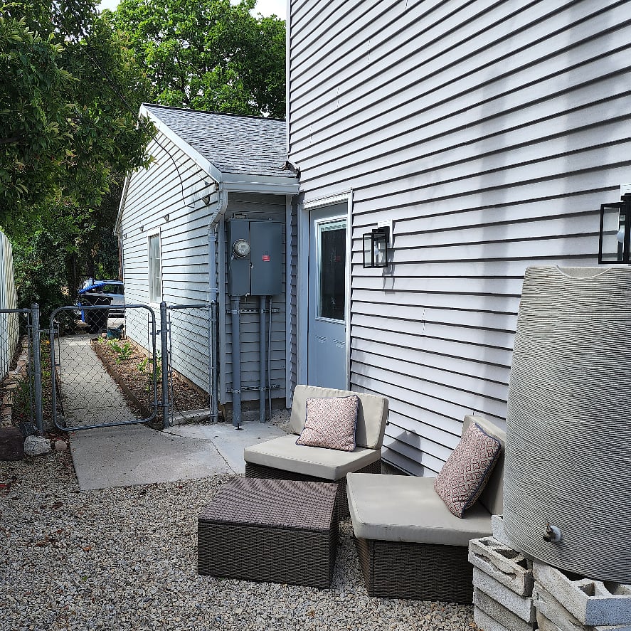 Private fully fenced outdoor area. Door is the entrance to the ADU (which is only attached to the main house garage)