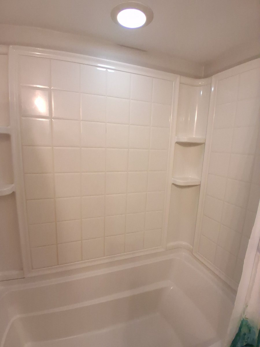 Shower/tub combination features nice deep tub for soaking