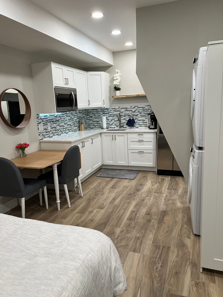 View from foot of bed into kitchen