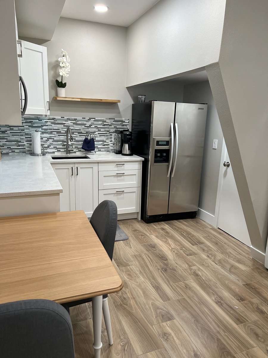 View from foot of bed into kitchen
