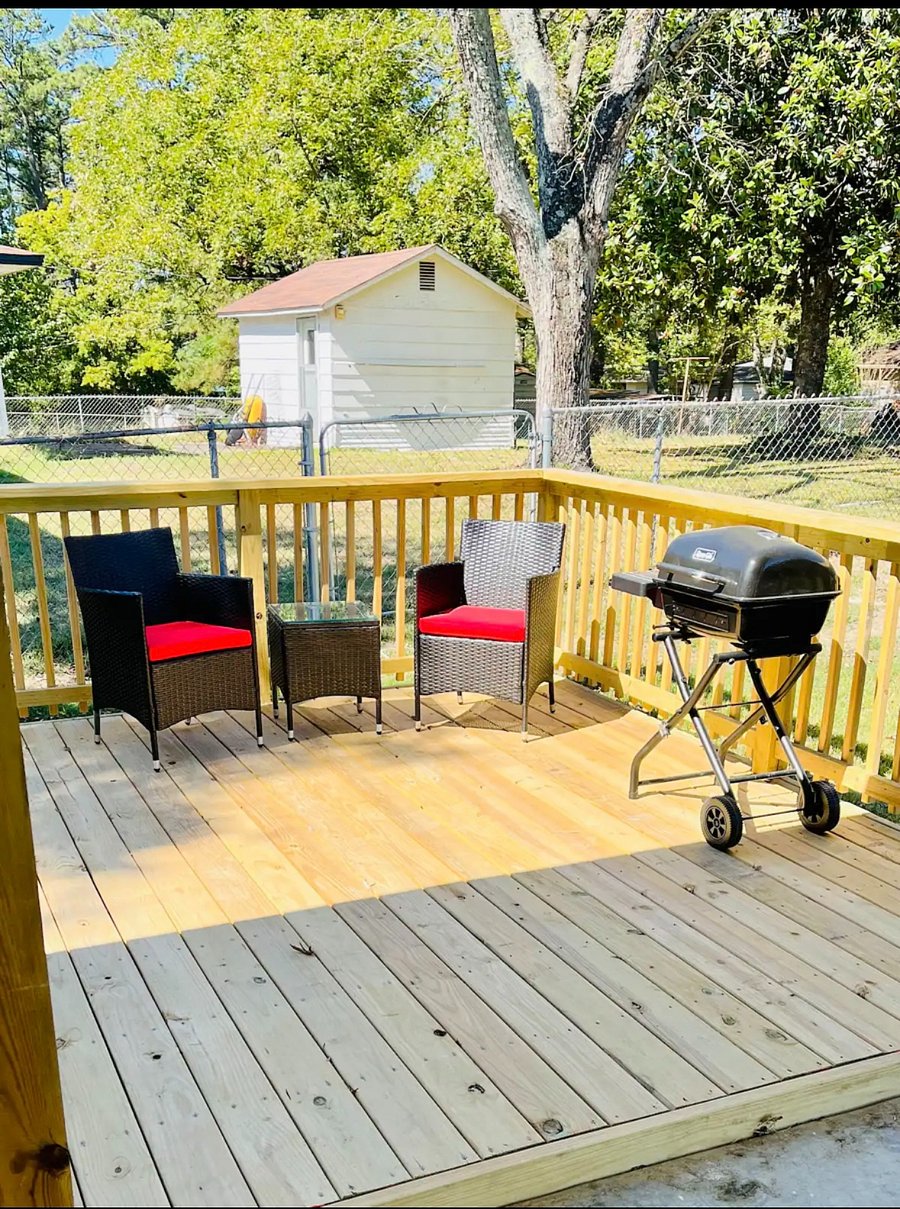 Outdoor patio area with grill.