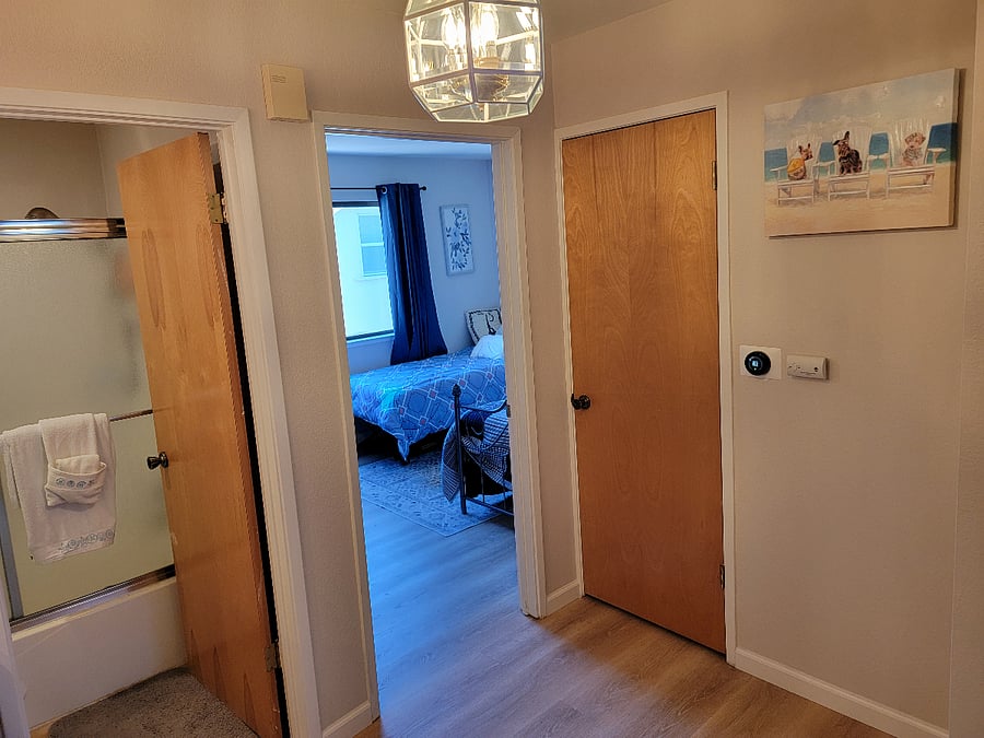 Landing from top of stairs looking and 2nd bedroom and 2nd bathroom