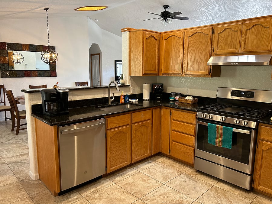The kitchen has all the appliances you'll need, including stainless steel dishwasher, range, and refrigerator, as well as a microwave, toaster, blender, electric teapot and Keurig coffee maker.
