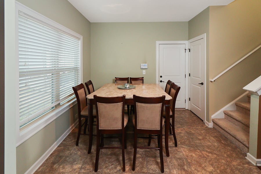 Gather in this elegant dining space, perfect for shared meals and lively conversations. Its warm, inviting atmosphere makes it a wonderful spot for creating lasting memories.