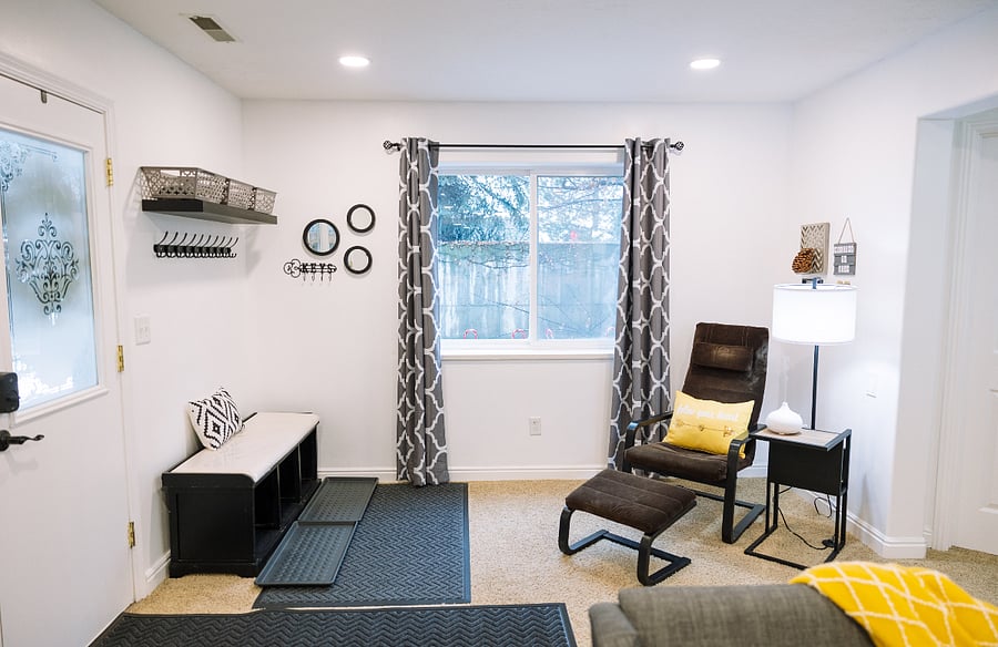 Entrance with storage for shoes and coats, reading corner