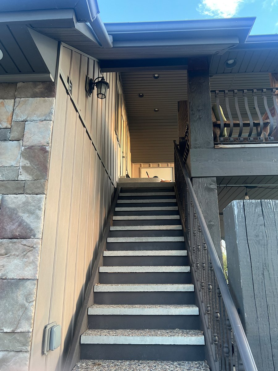 Staircase to front door and private balcony