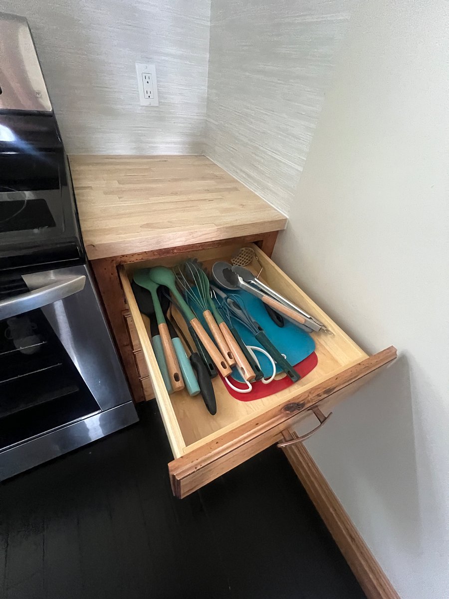 Full kitchen with small appliances and cooking utensils