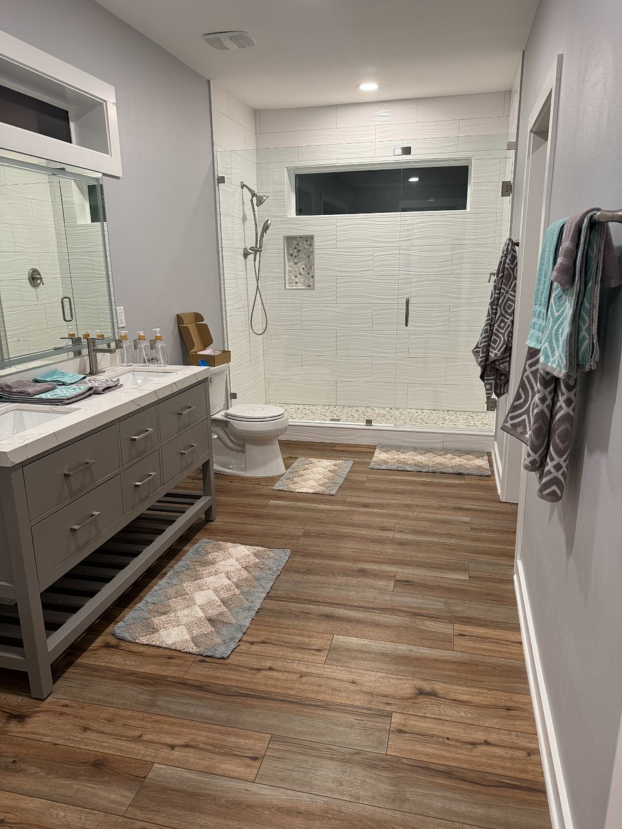 Full bath with walk-in shower and walk-in closet
