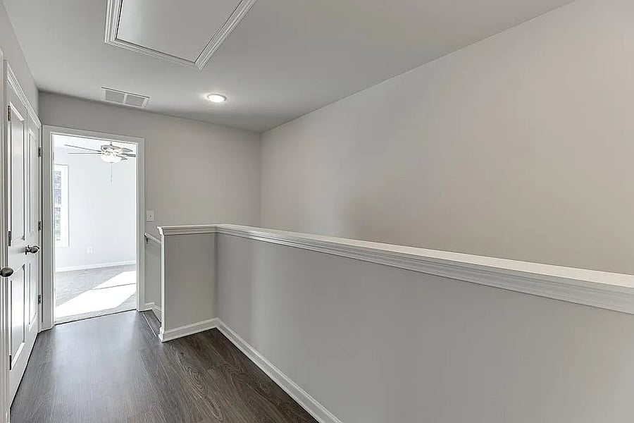 Hallway upstairs separating both In-Suite Bedrooms.