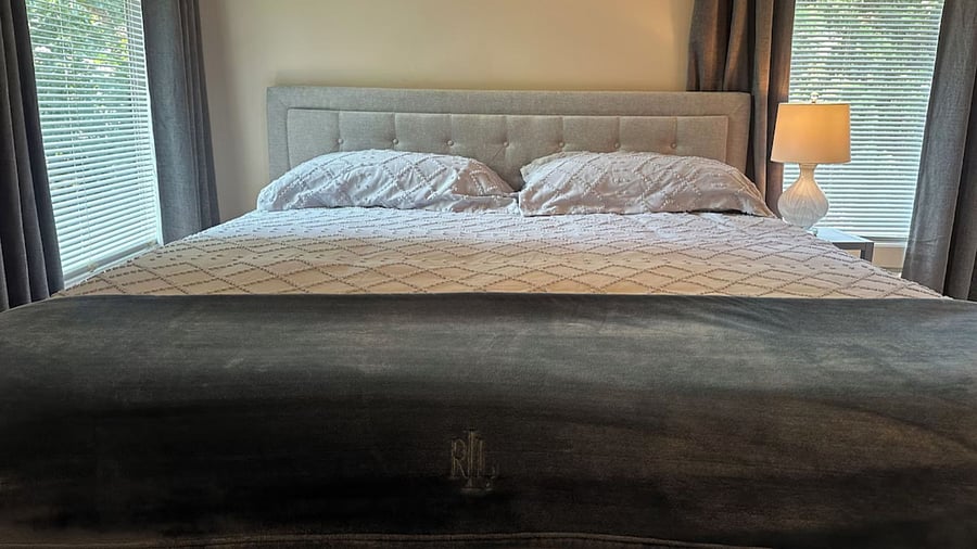 Primary Bedroom with King Bed, new Hybrid Mattress, and Blackout Curtains. 
