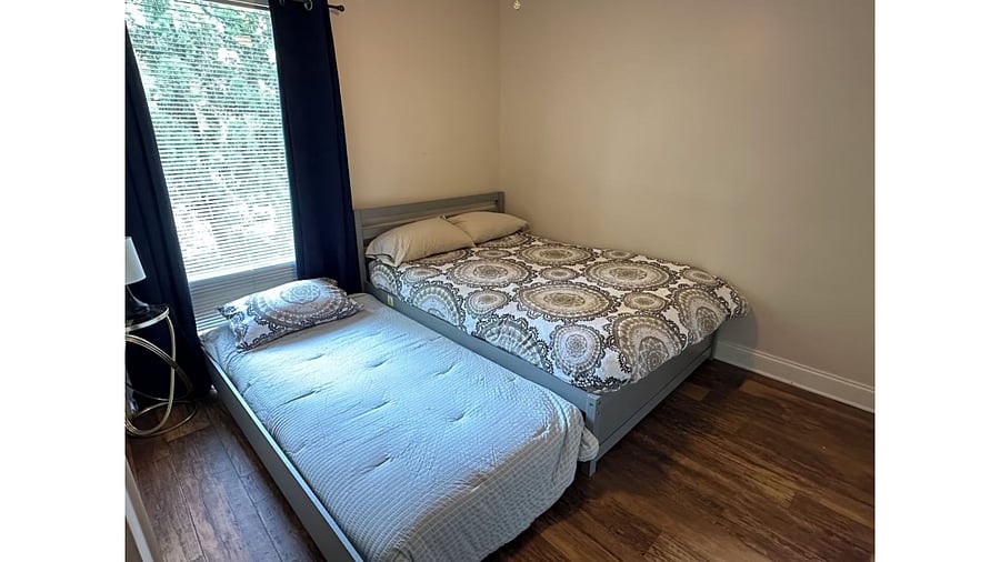 Guest Bedroom with Full Size Bed and Twin Size Bed pulled out. 