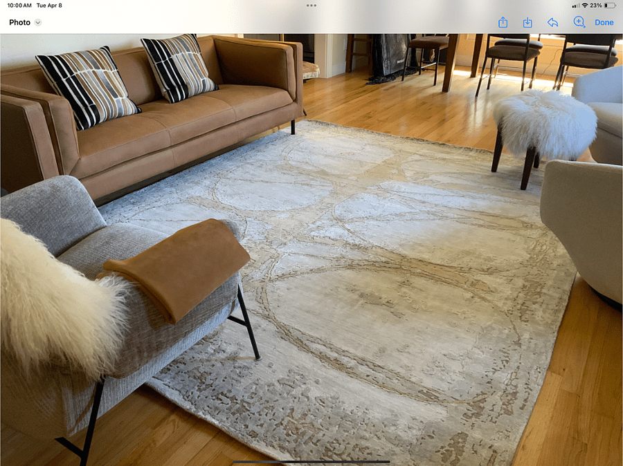 Private living room are with beautiful leather sofa, cream swivel chairs, and TV