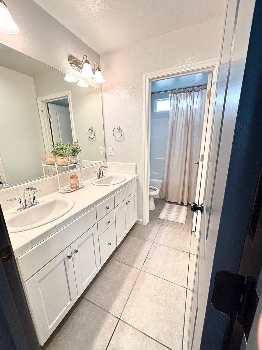 Shared bath with private sinks and cabinets