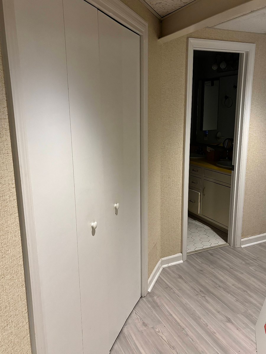 Hallway closet, bathroom door open