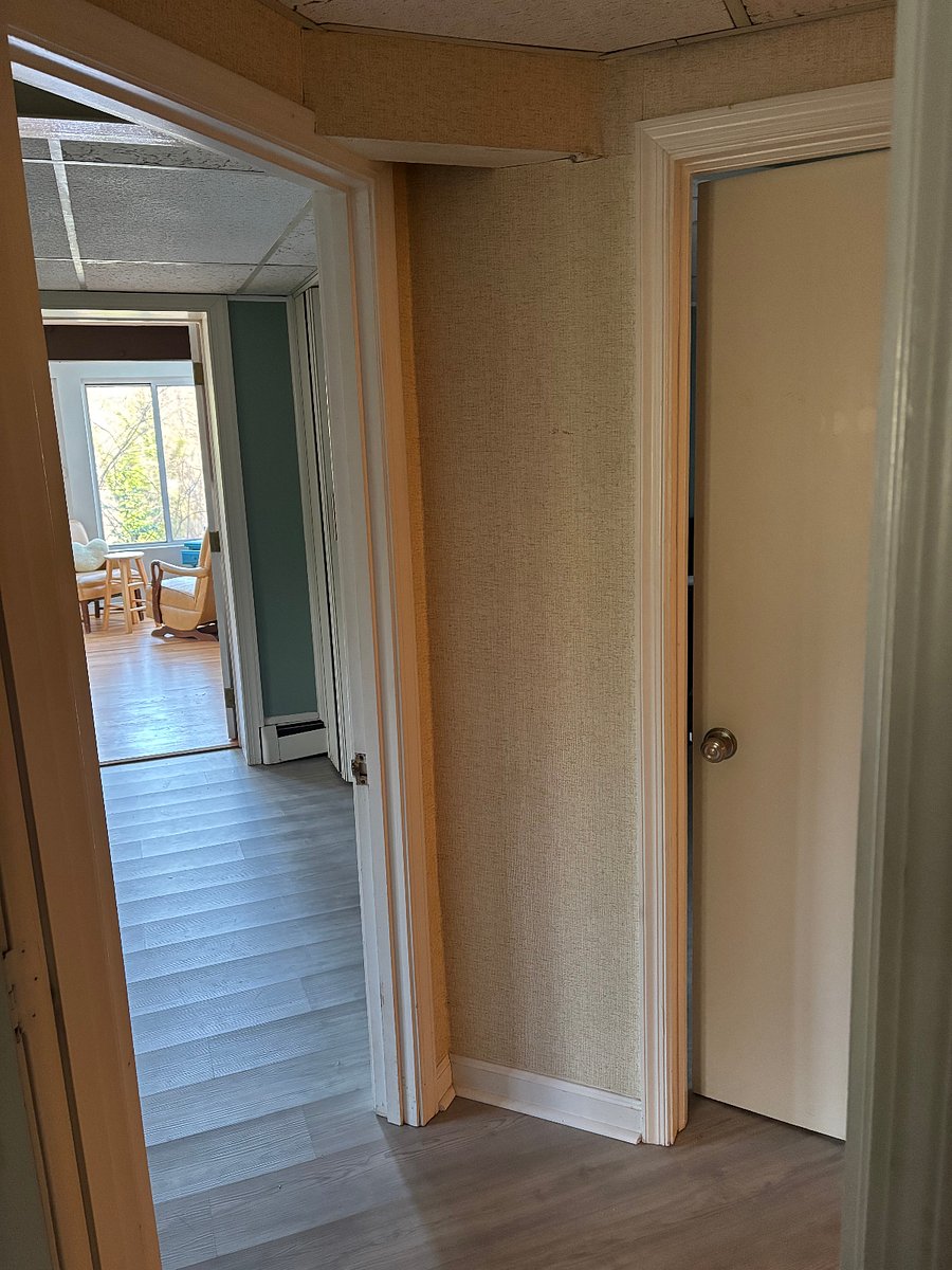 hallway that leads to kitchenette from bedroom