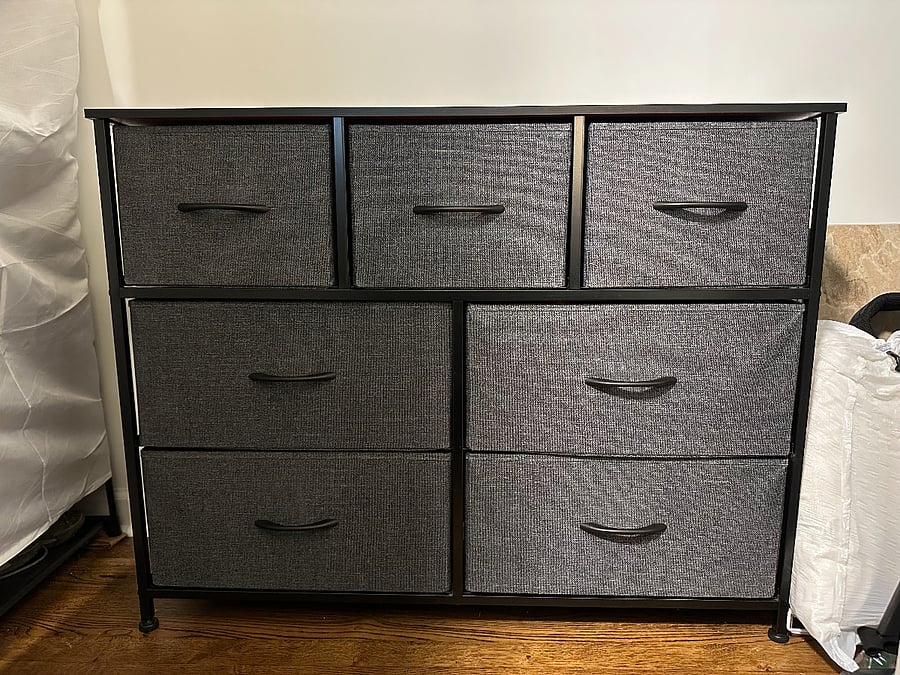 A wardrobe inside the secondary bedroom closet