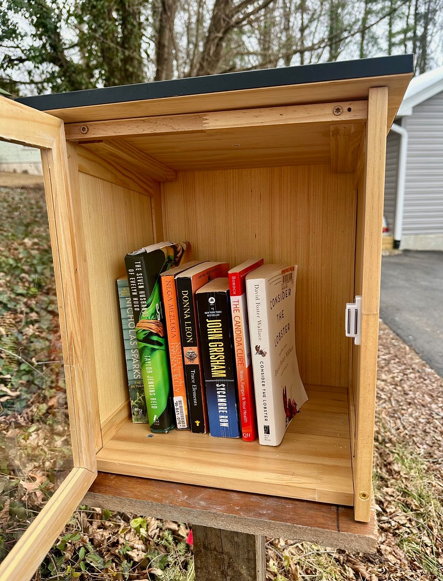 This house comes with a Little Free Library! Take a book, leave a book.