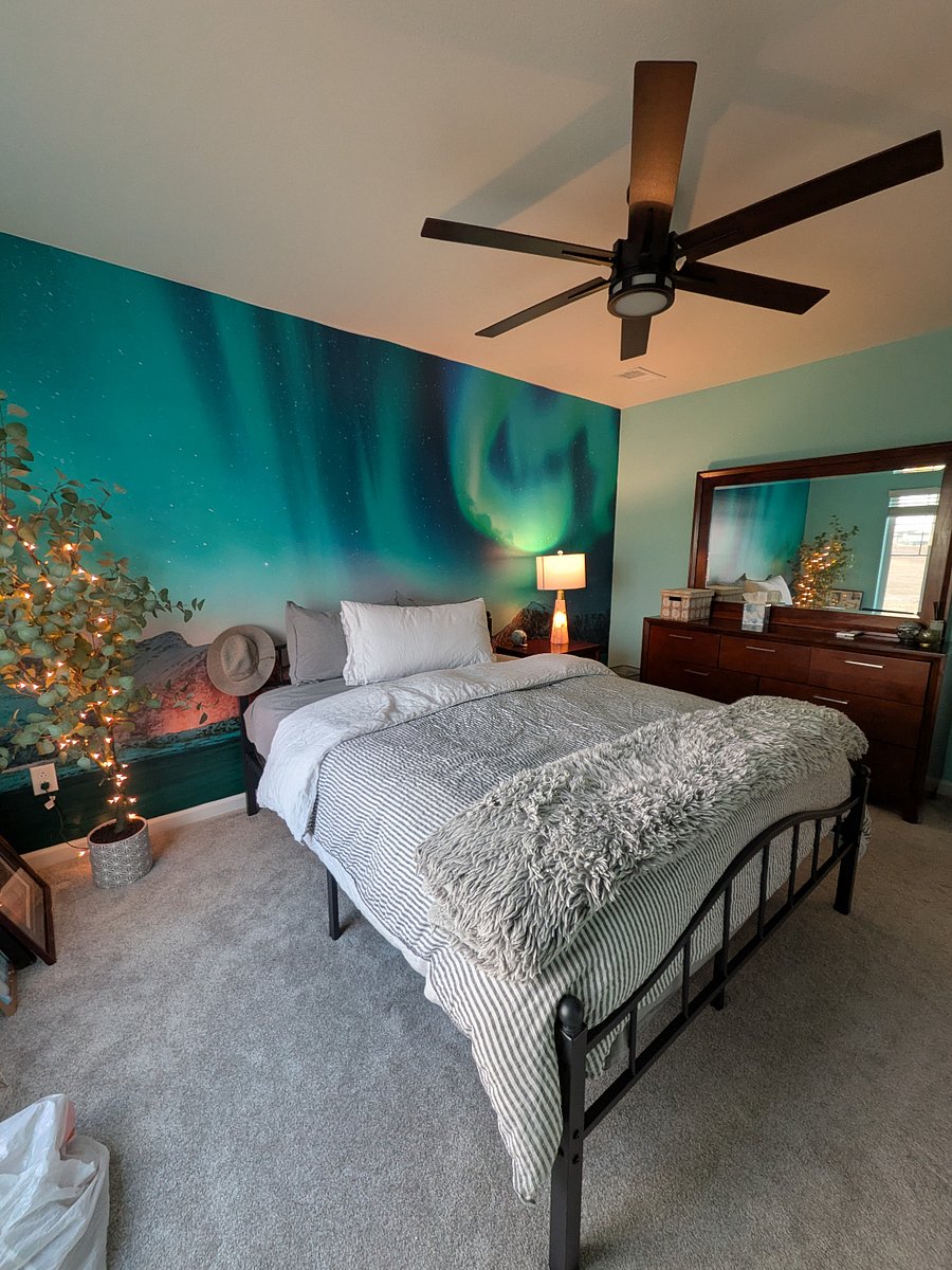 Glacier room, complete with queen bed, dresser with mirror, nightstand, and lamp.