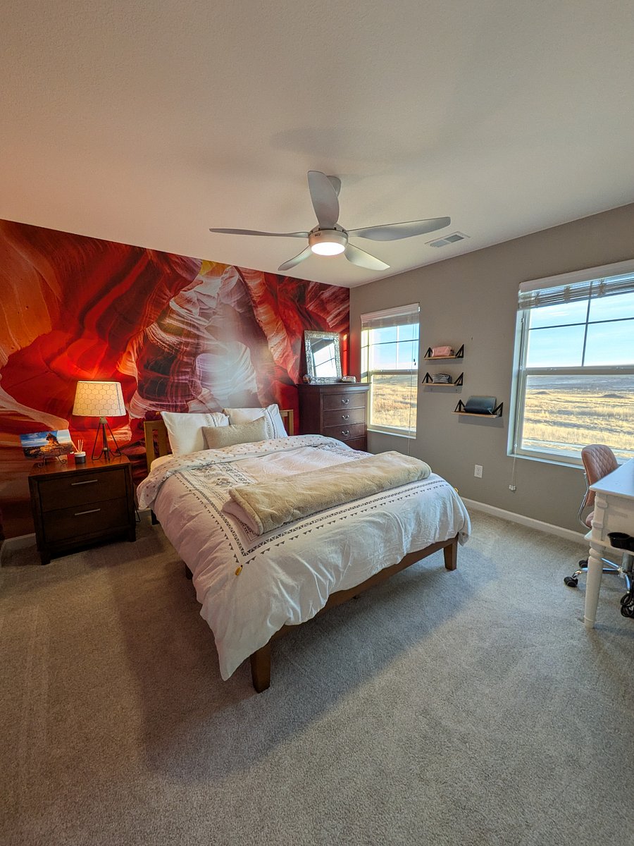 Canyon room, complete with queen bed, dresser, night stand, and vanity.
