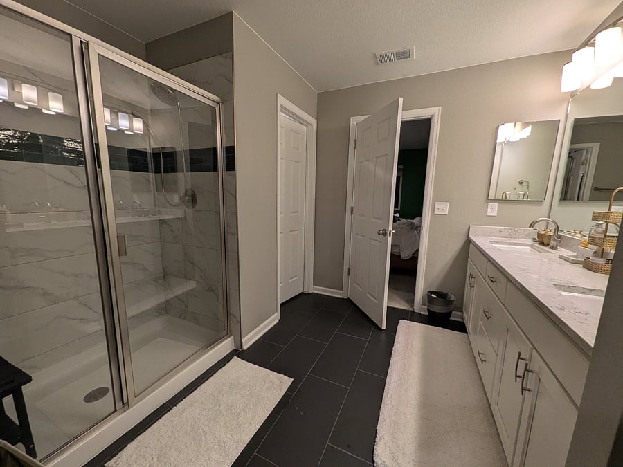 Primary bath: glass-door shower.