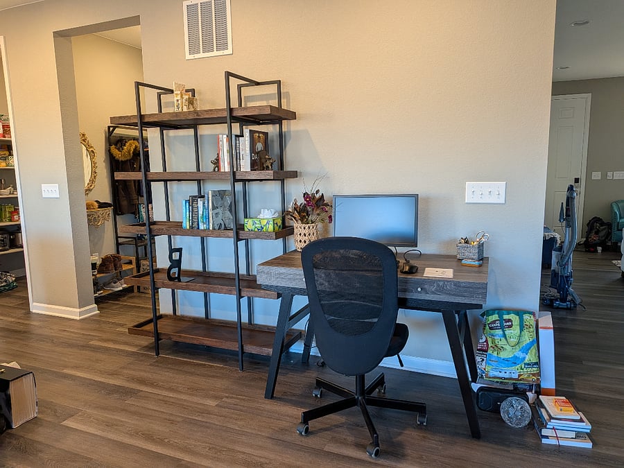 Living room desk offers a second working location.