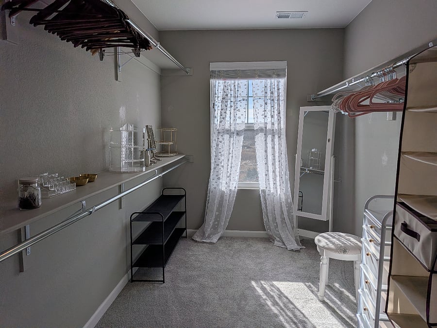 A closet so big it could be a forth room! Complete with mirror, hangers, and organizers.