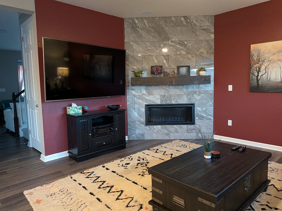 The main living area has an 80" smart TV with 5.1 surround sound speakers and a beautiful gas fireplace.