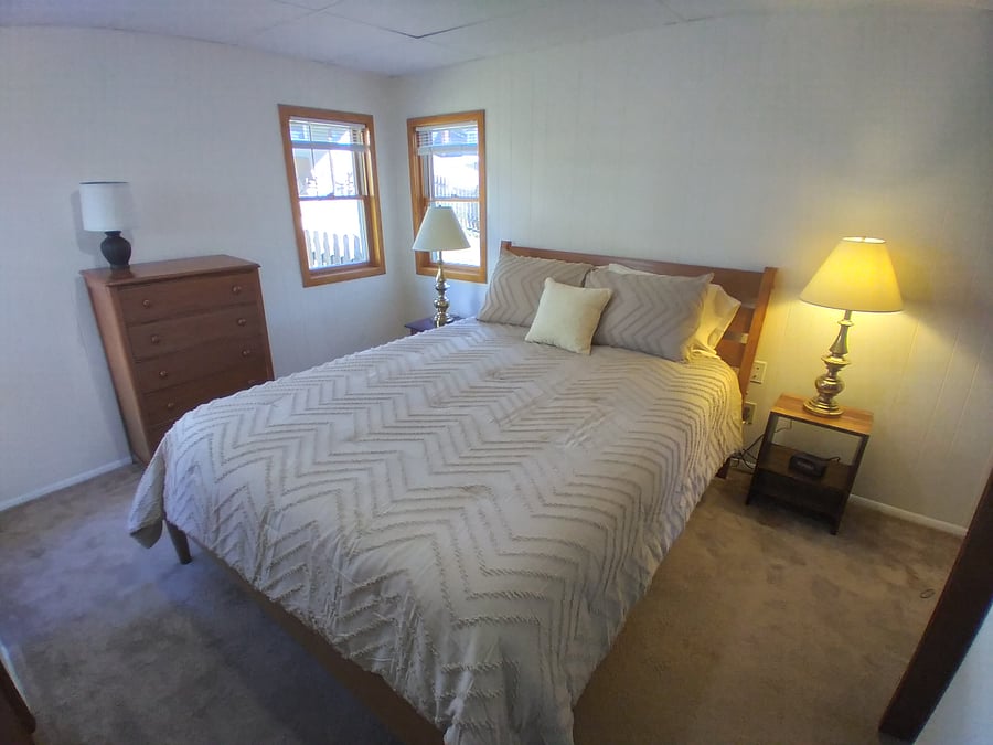 First floor bedroom with queen bed