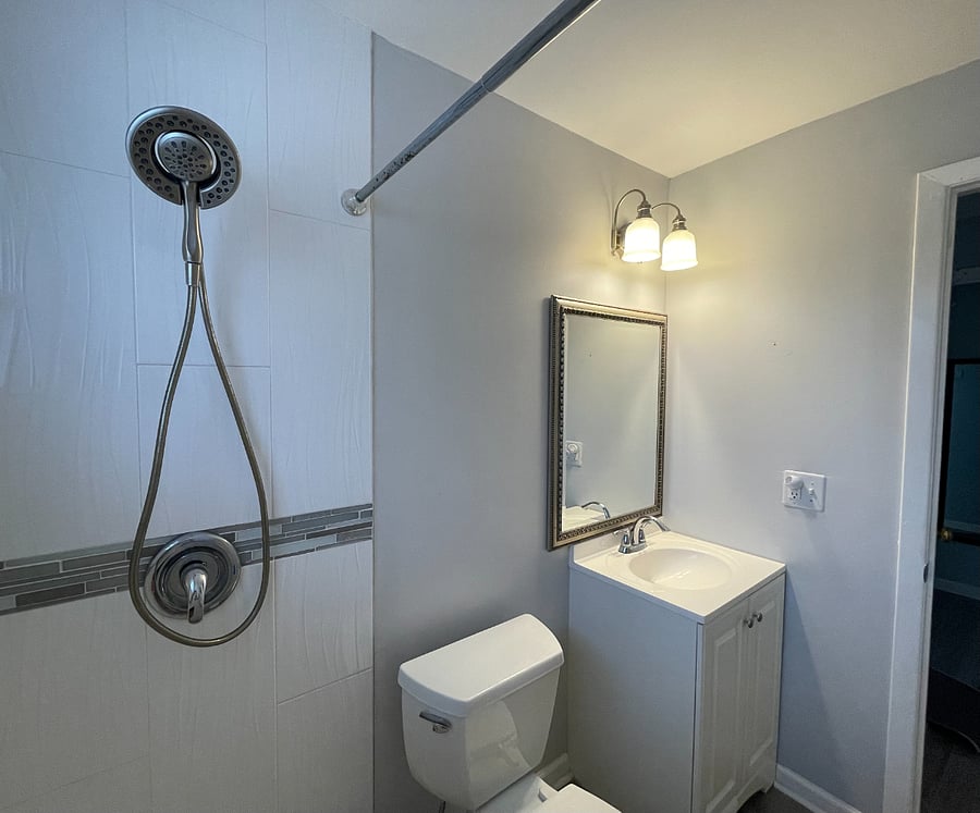 Neat & clean bath with step in shower.