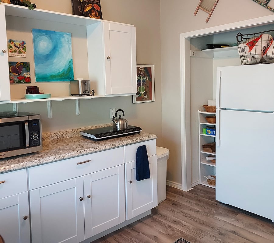 Kitchen with full size refrigerator and plenty of storage