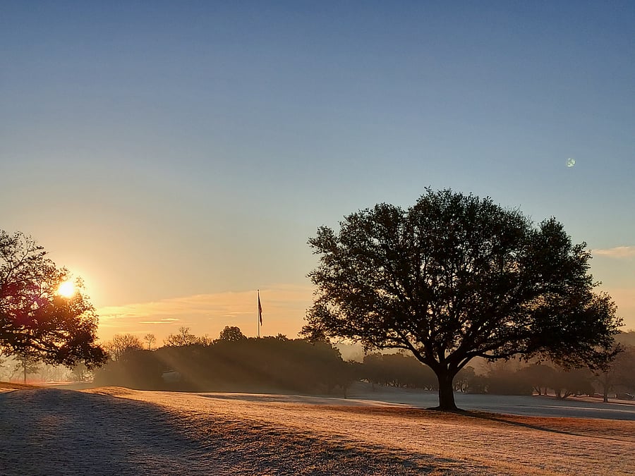 Beautiful serene sunrise across the street at Flagpole Hill