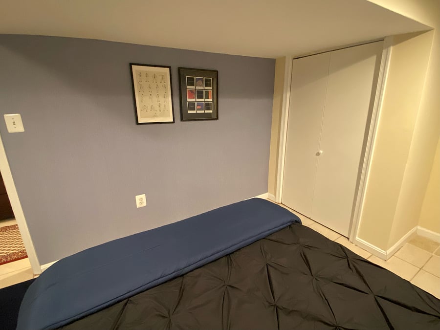 Bedroom has one large closet, and additional closet is located in hallway outside of bedroom.
