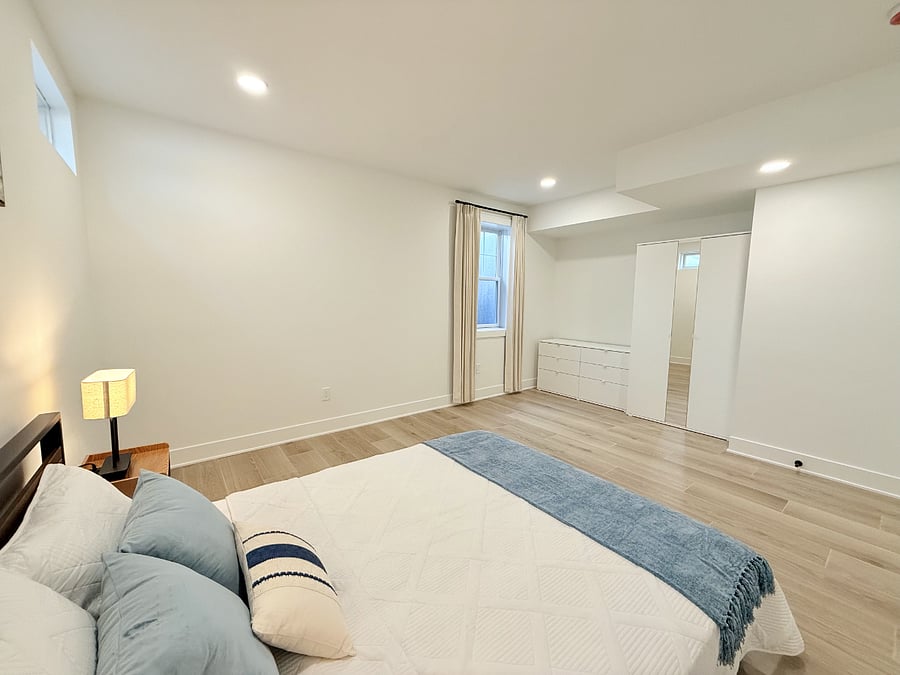 Specious bedroom with luxury bedding, custom blackout curtain, and brand new closet system with tons of storage