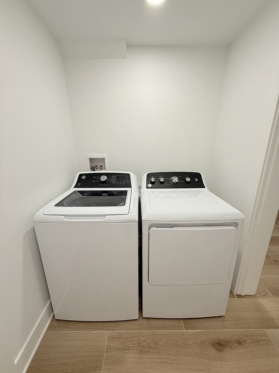 Separate brand new washer & dryer in-unit. Iron, ironing board, detergent will be provided