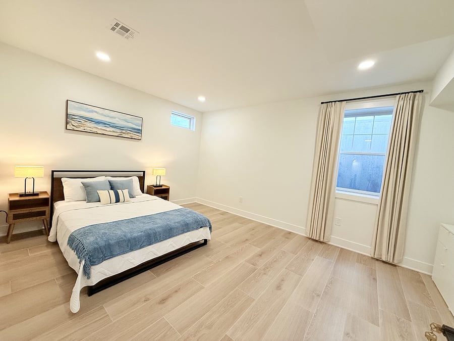 Specious bedroom with luxury bedding, custom blackout curtain, and brand new closet system with tons of storage
