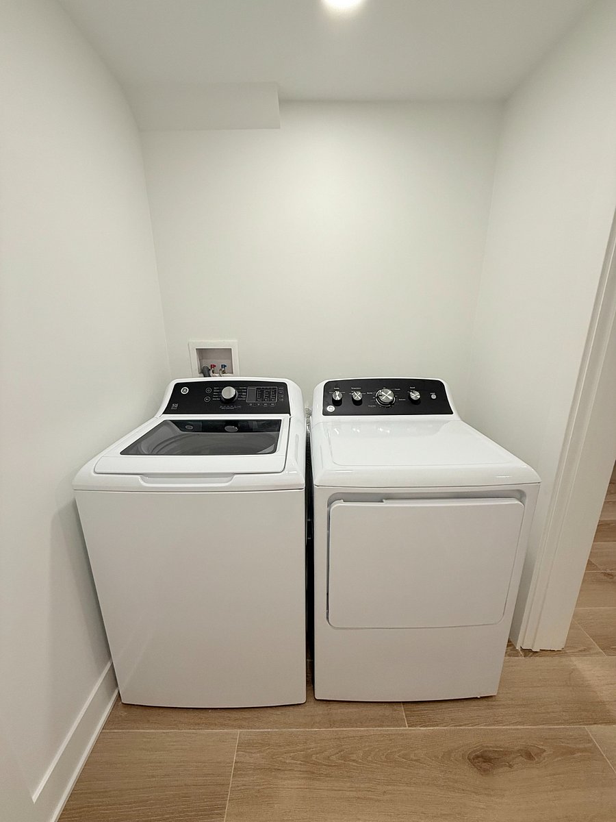 Separate brand new washer & dryer in-unit. Iron, ironing board, detergent will be provided